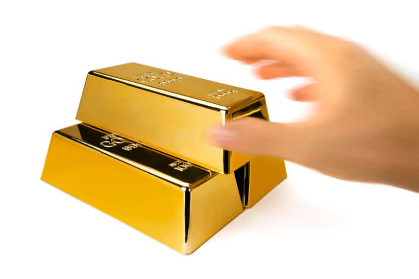 taking a bar of gold